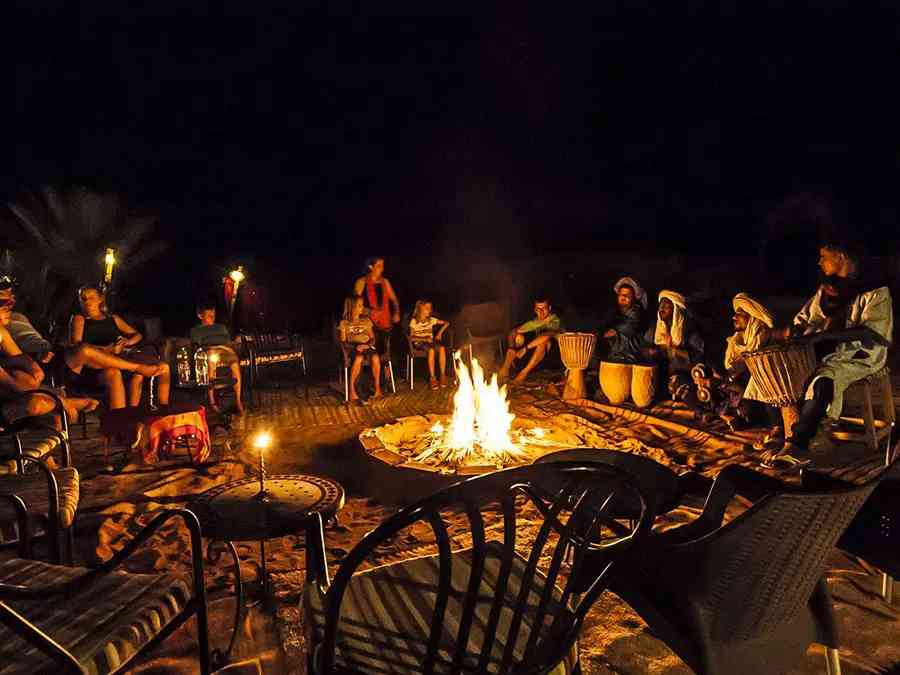 Enjoy an evening around a campfire with traditional Berber music in the Sahara Desert.