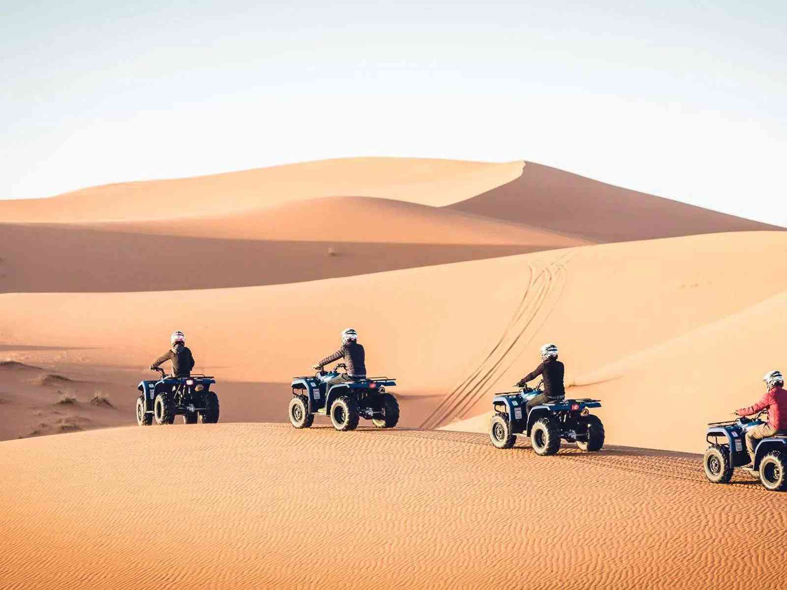 Quad biking thrills on the Erg Chebbi dunes, a highlight of your private 3-day desert adventure.